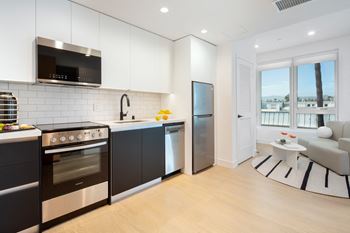 Well Equipped Kitchen And Dining at Miles at Harvard, Los Angeles